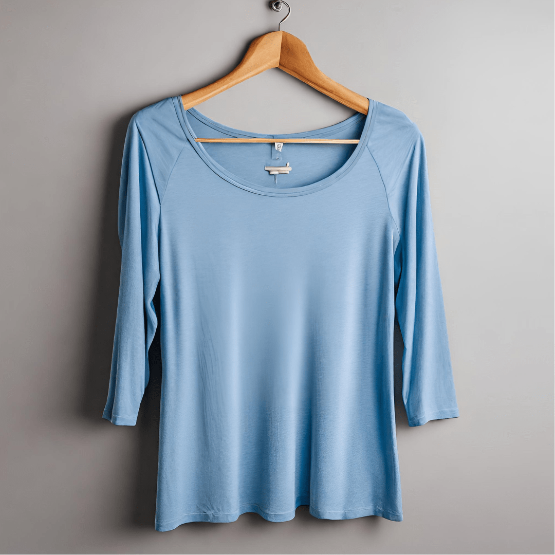 Light blue woman's T-shirt hanging on hanger.Picture